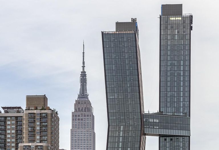 The American Copper Buildings at 626 First Avenue, Manhattan, New York, with the Empire State Building in the background.