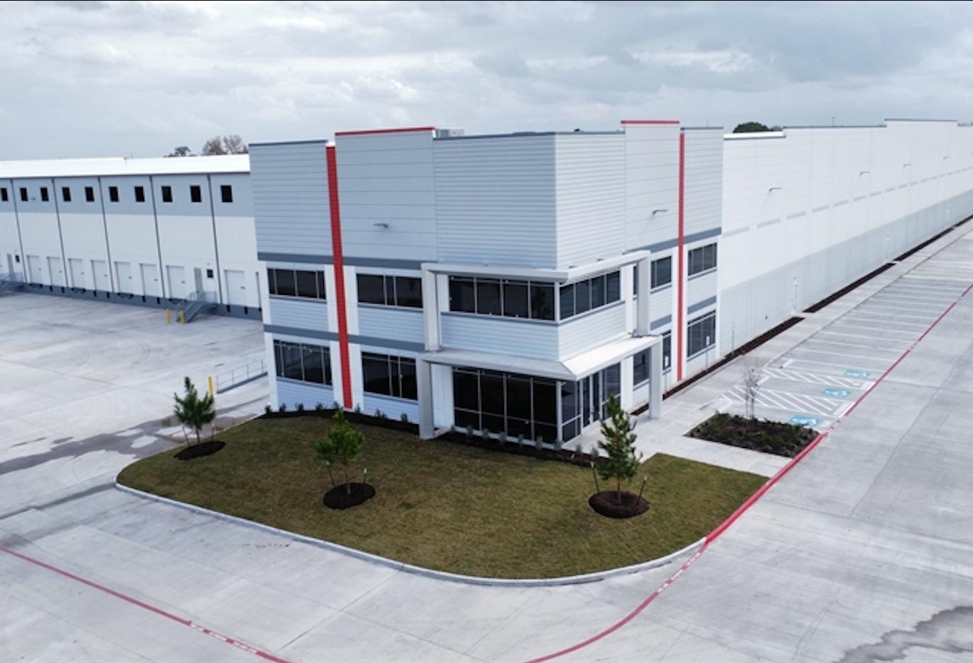 The exterior of a white industrial building