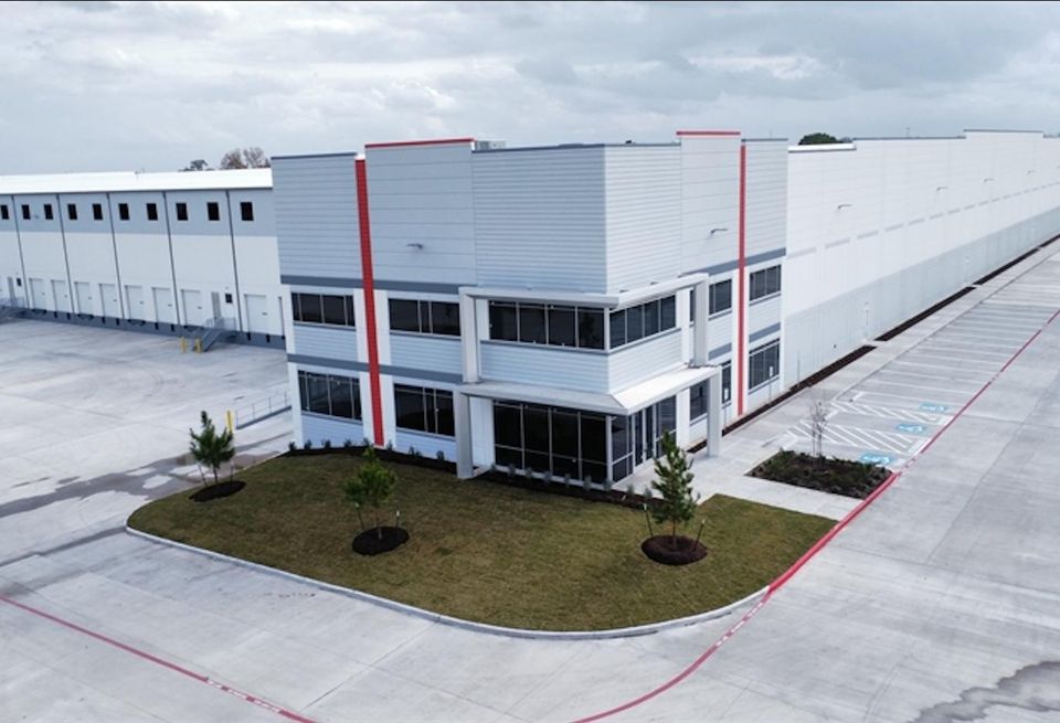 The exterior of a white industrial building