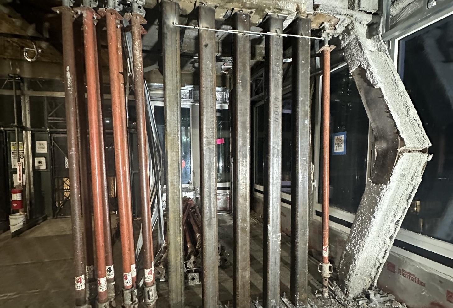 Building inspectors detected multiple beams and columns in the 42nd Street conversion project that buckled under the weight of an 11-story addition.