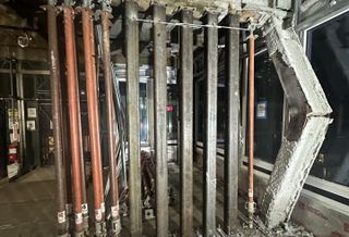Building inspectors detected multiple beams and columns in the 42nd Street conversion project that buckled under the weight of an 11-story addition.