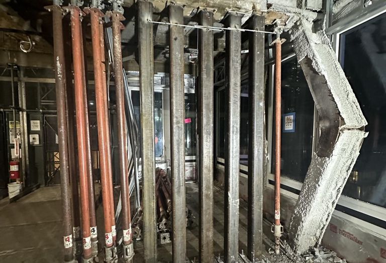 Building inspectors detected multiple beams and columns in the 42nd Street conversion project that buckled under the weight of an 11-story addition.
