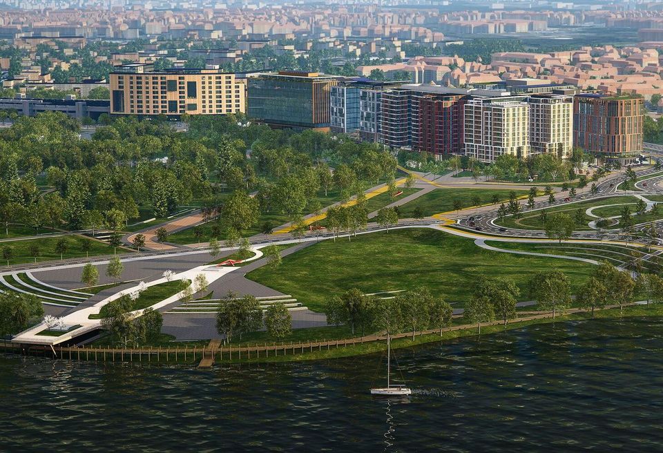 An aerial rendering of the Bridge District looking east across the Anacostia River