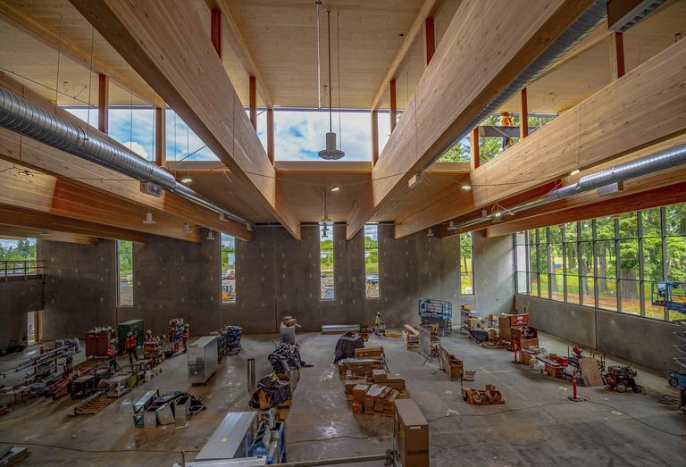 Construction over the summer at the now-completed Hidden Creek Community Center in Hillsboro, Oregon, showing the 91-foot glulam beams.