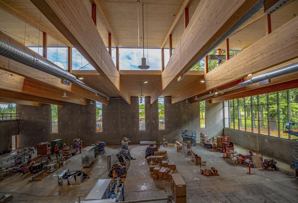Construction over the summer at the now-completed Hidden Creek Community Center in Hillsboro, Oregon, showing the 91-foot glulam beams.