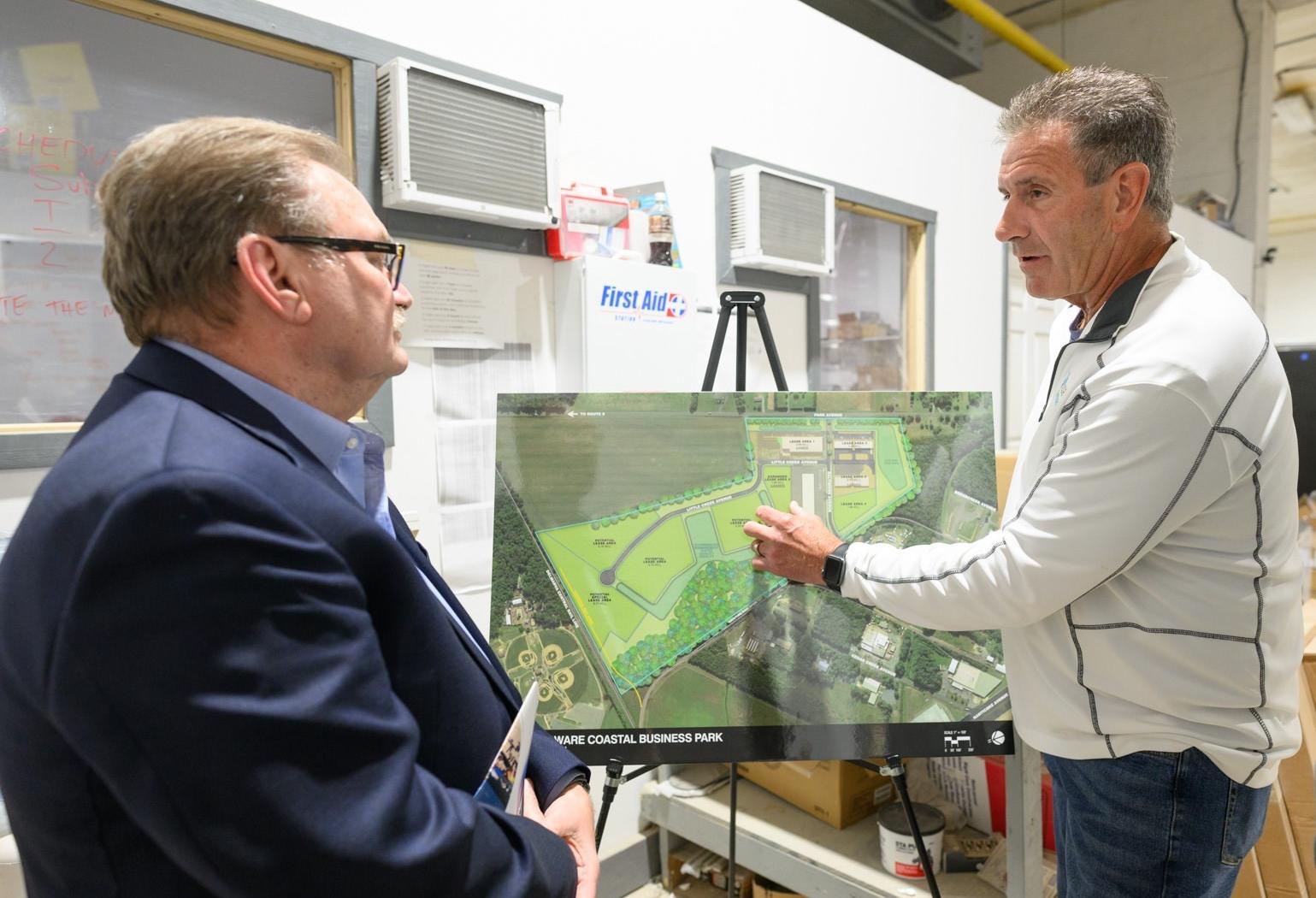 Sussex County Economic Development Director Bill Pfaff (left) and Great Outdoor Cottages COO Mike Scheid discuss GOC’s location in Delaware Coastal Business Park in Georgetown.