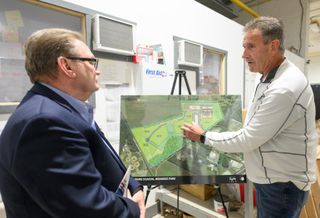 Sussex County Economic Development Director Bill Pfaff (left) and Great Outdoor Cottages COO Mike Scheid discuss GOC’s location in Delaware Coastal Business Park in Georgetown.