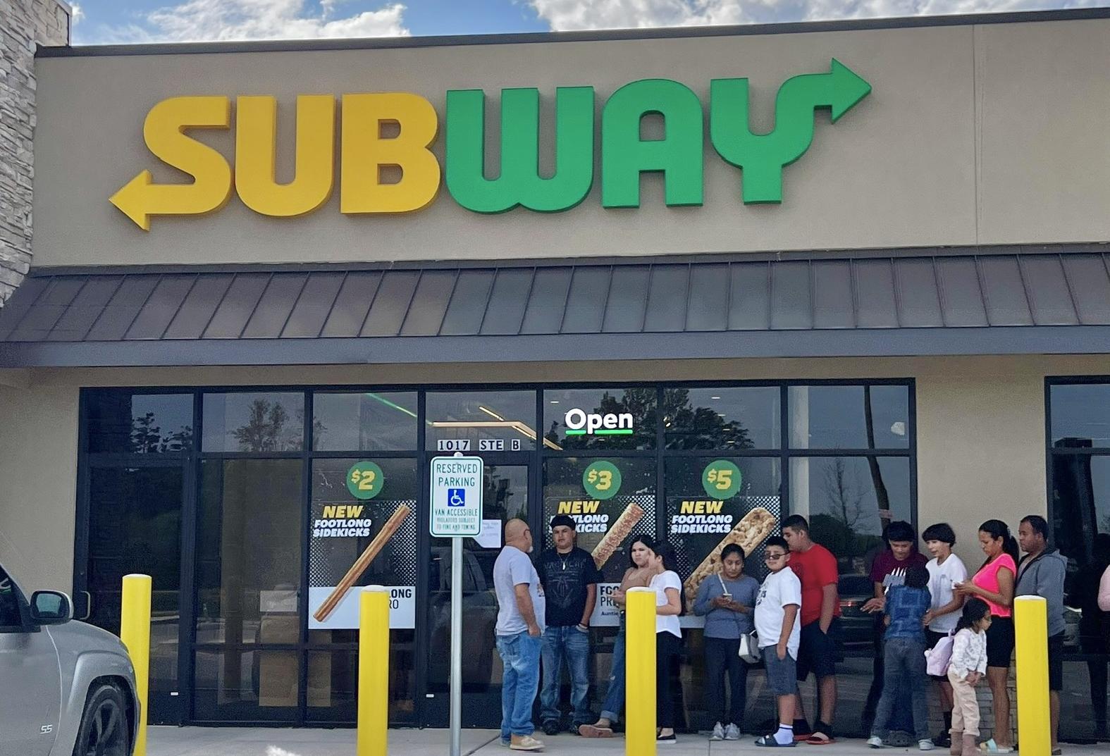 People line up for Subway on County Road 5270 in the Colony Ridge community, which gave away free sandwiches when it opened in March.