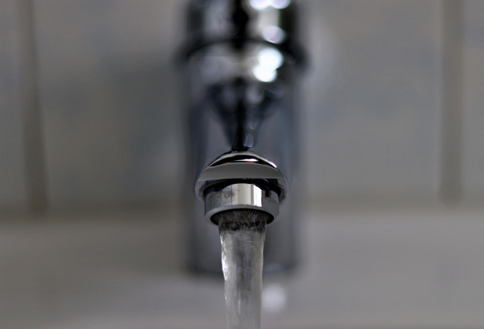 Tap water flowing close up