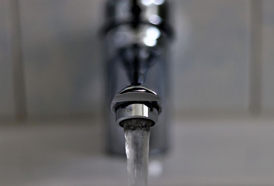 Tap water flowing close up