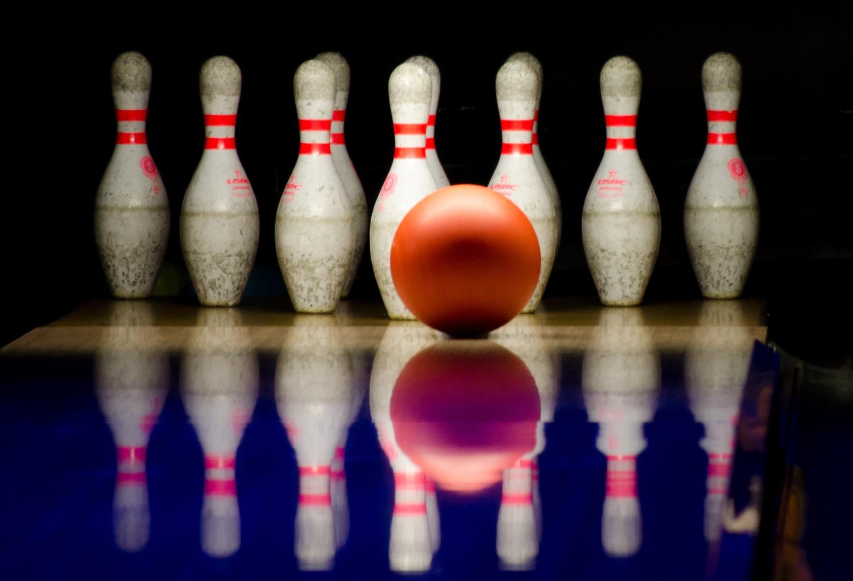 Bowling ball about to hit skittles