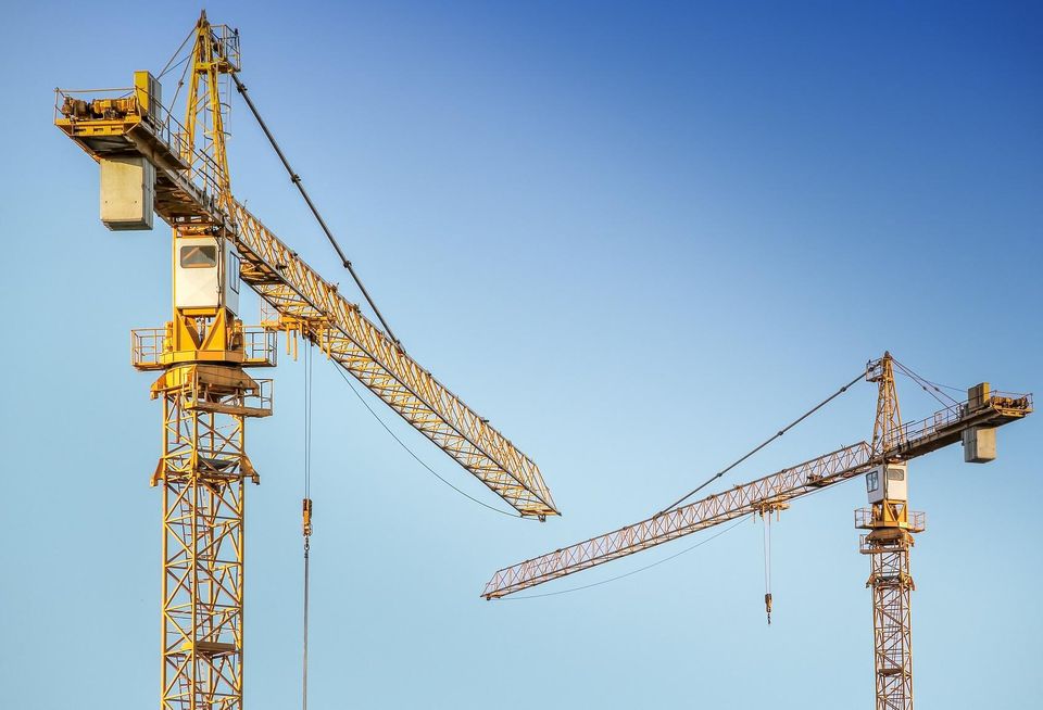 Cranes in sky