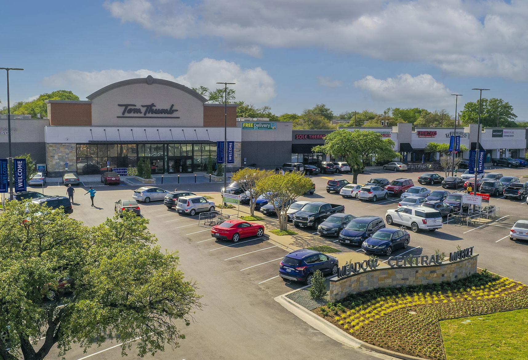 grocery store facade and parking lot