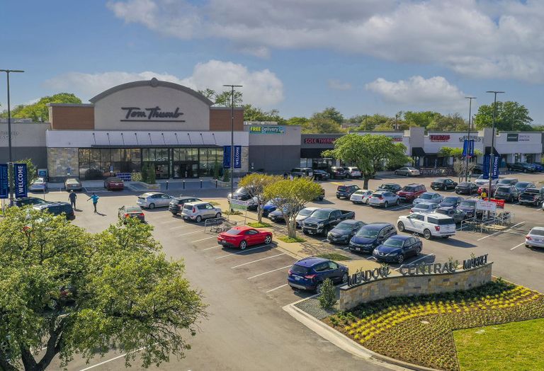 grocery store facade and parking lot