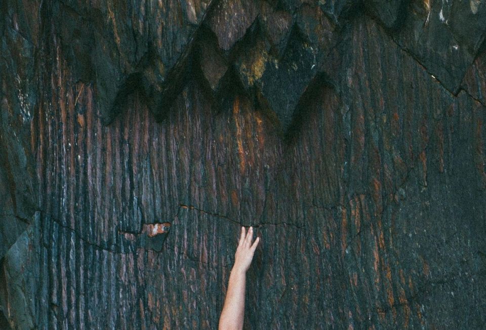 hanging from a cliff
