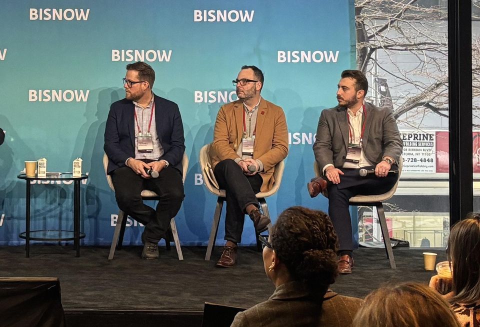 KTA Engineering's Kyle Twitchell, Magnusson Architecture and Planning's Christopher Jones and Rudin's Harrison Schaffer onstage at Bisnow's 2026 New York Conversions and Building Upgrades conference.