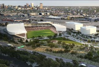 A rendering of a soccer stadium and mixed-use buildings in downtown Denver.