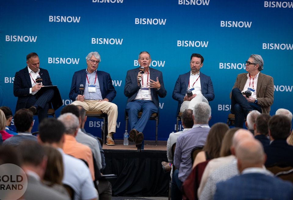A high-resolution professional image of a panel at Bisnow's State of Colorado Springs event