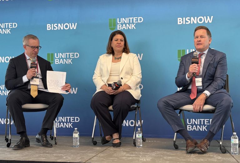 PRP's Paul Dougherty (right) last month at Bisnow's D.C. State of the Market, alongside Deputy Mayor Nina Albert and CohnReznick's Michael Harlow. 