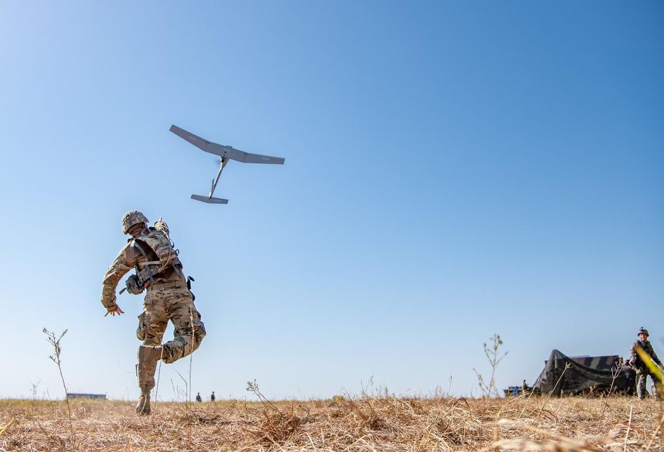 military drone U.S. Army Spc. Ian Kenny, a fire control specialist with 2nd Battalion, 4th Field Artillery Regiment, 75th Field Artillery Brigade, throws a RQ-11 Raven System into the sky in order to have a birds-eye view of the Battalions area of operations during a field training exercise at Fort Sill, Oklahoma, Aug 21, 2019. (U.S. Army photo by Sgt. Dustin D. Biven)