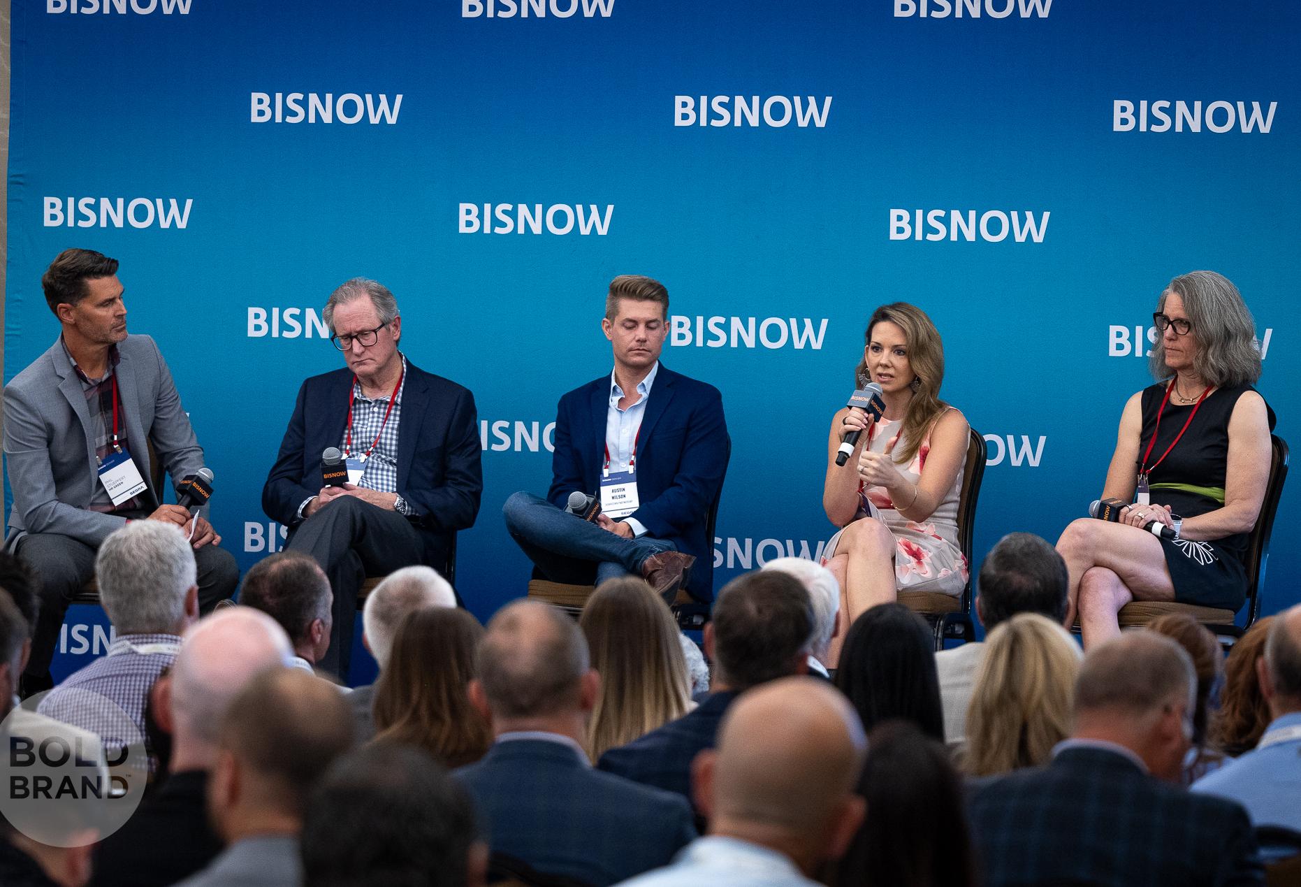 A high-resolution professional image of a panel at Bisnow's State of Colorado Springs event
