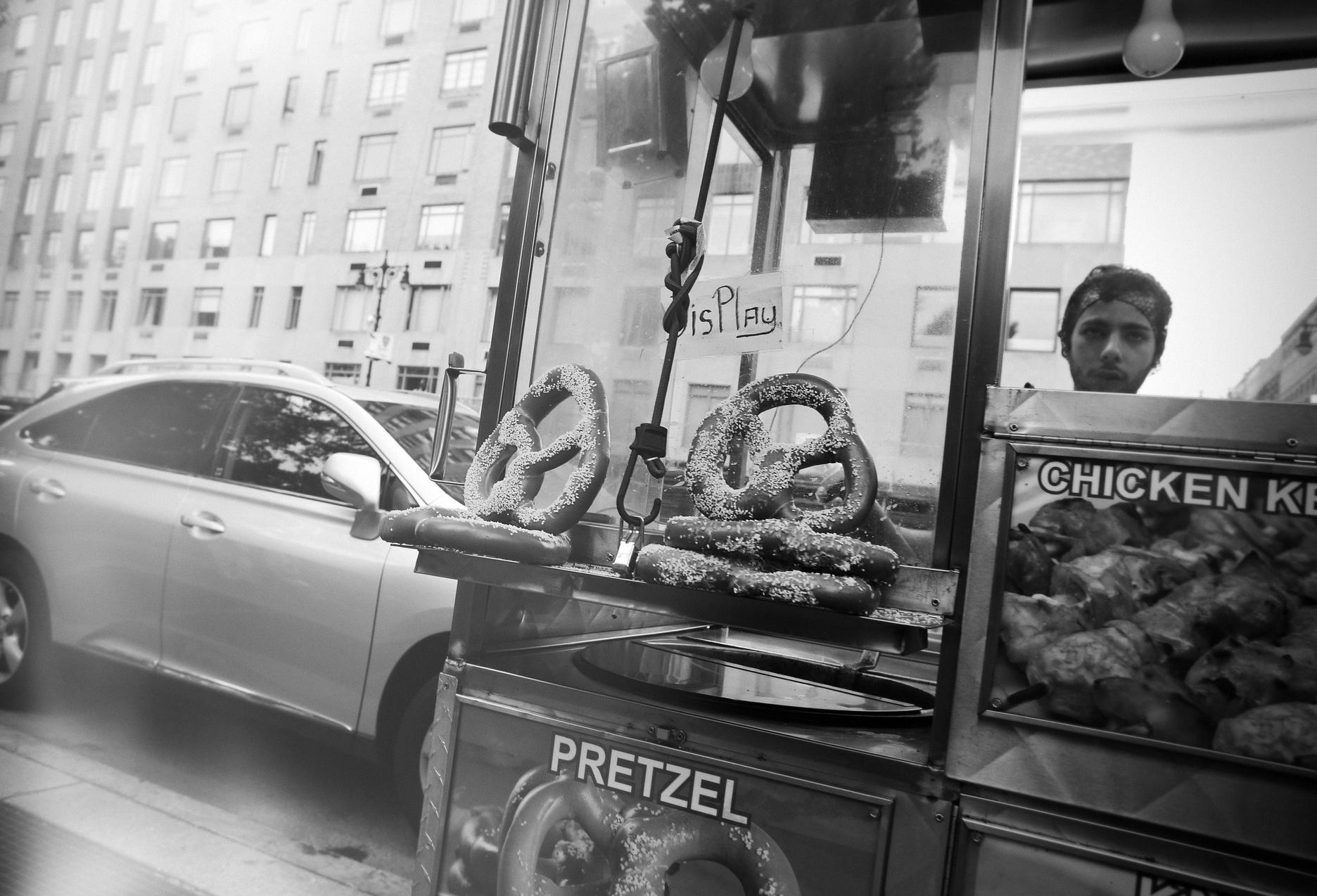A street vendor selling pretzels