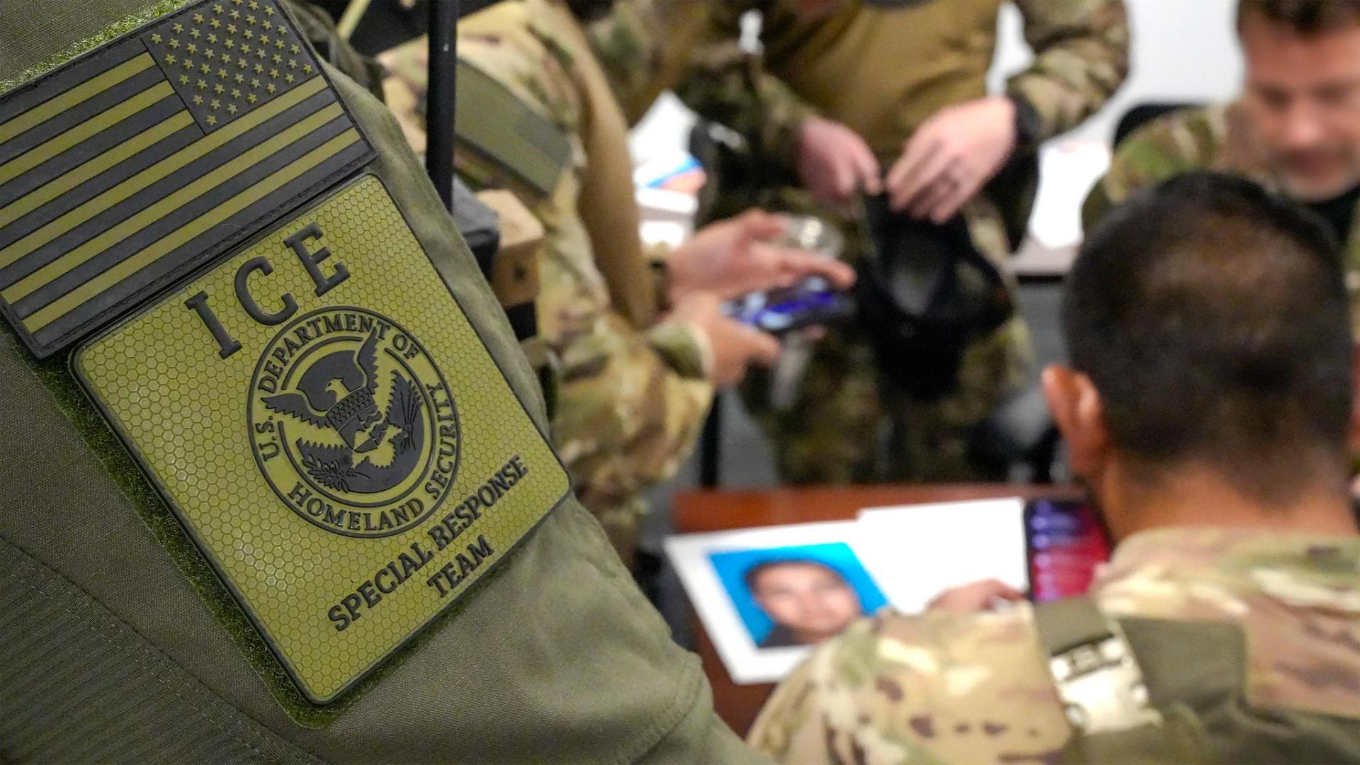 ICE officers in fatigues