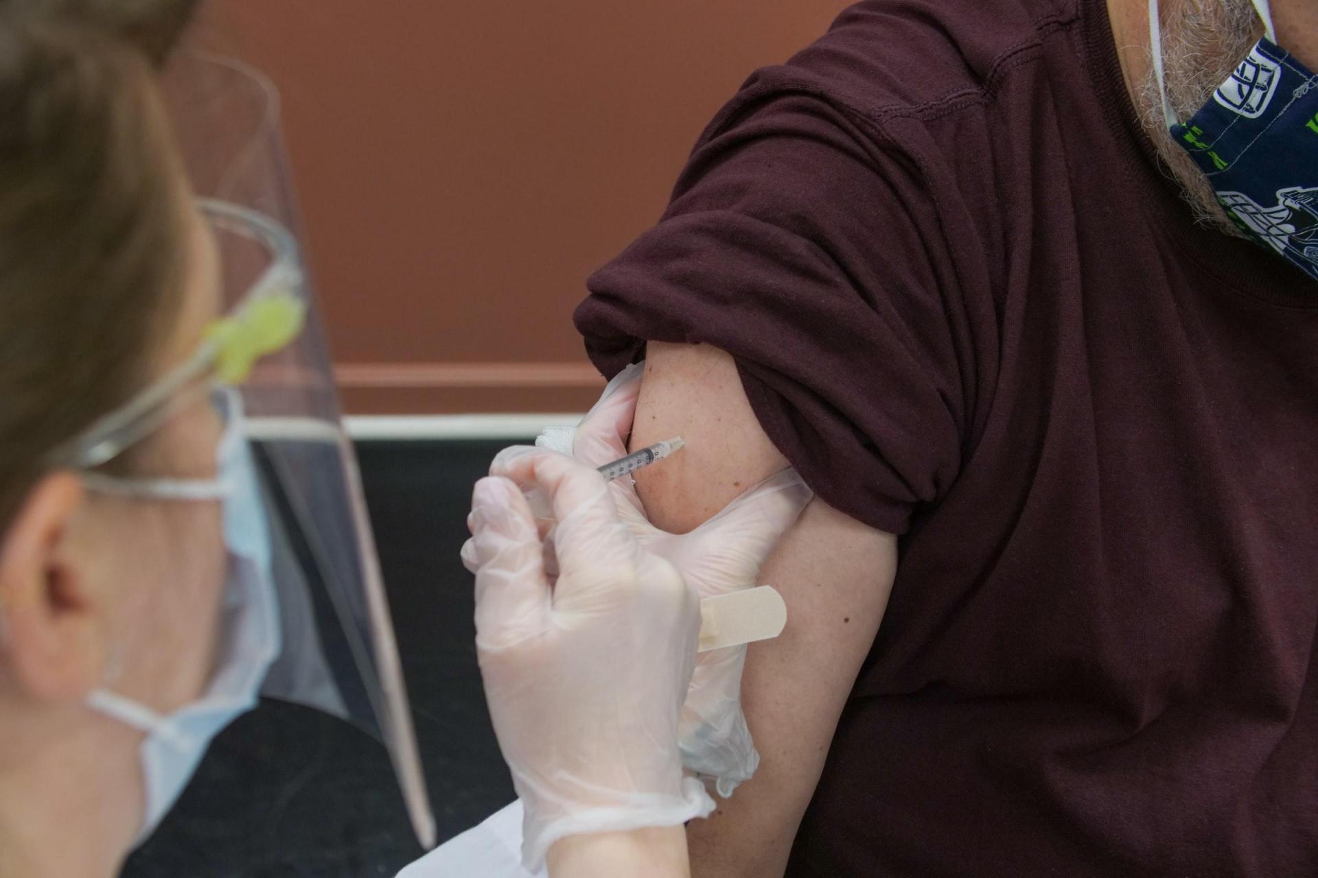 Nurse/doctor injecting vaccine