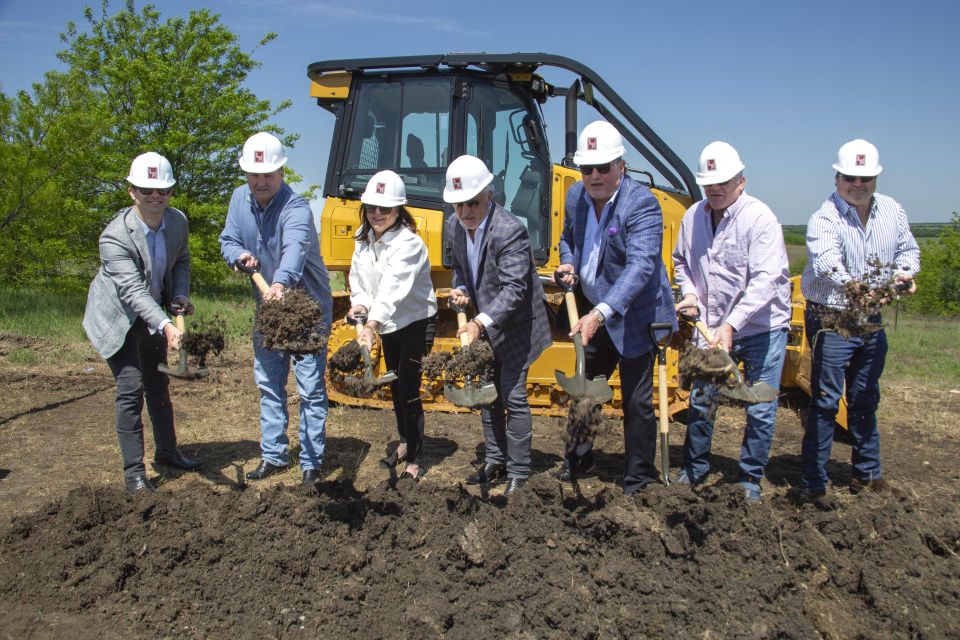 people shoveling dirt