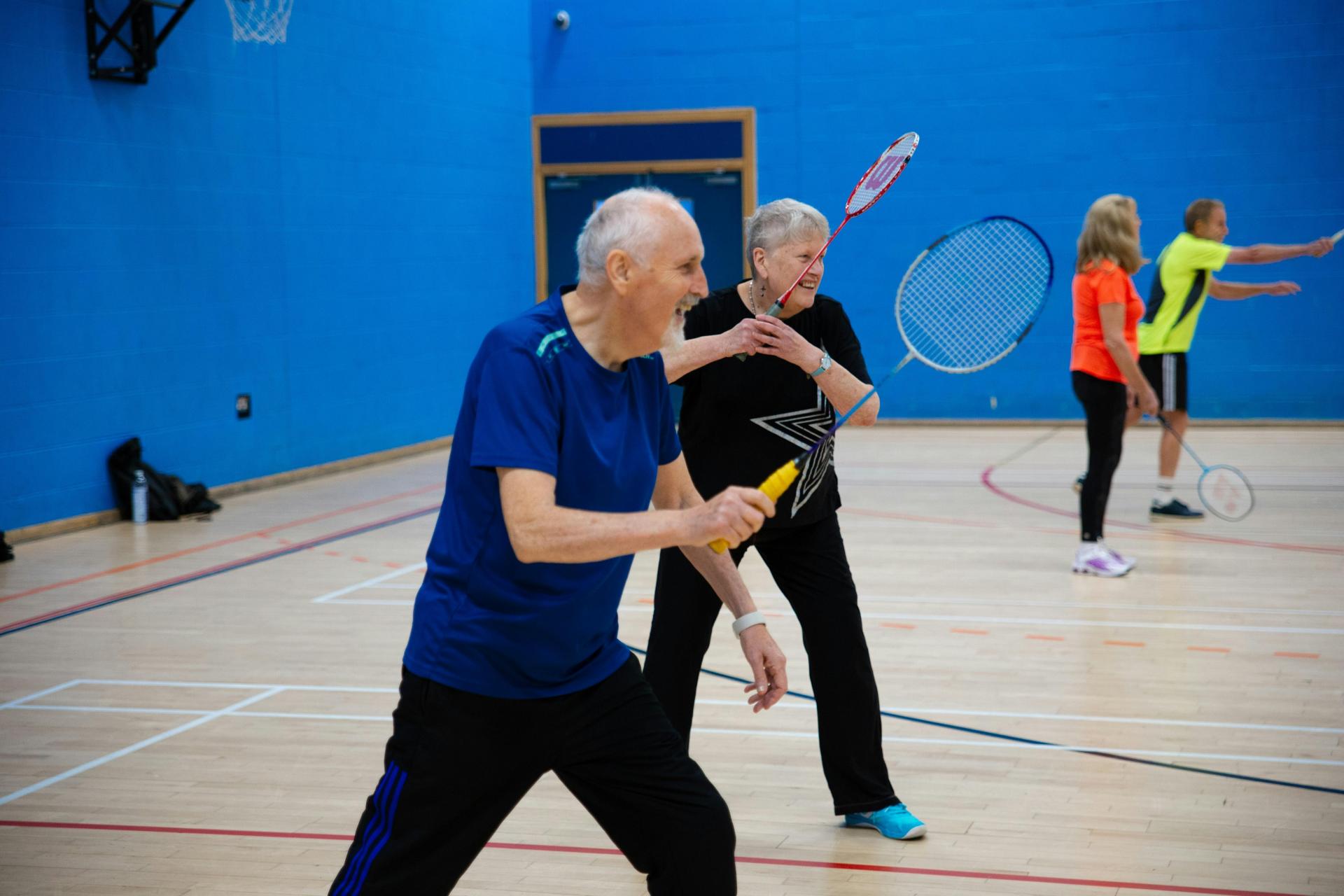 Playing a sport in a blue gym
