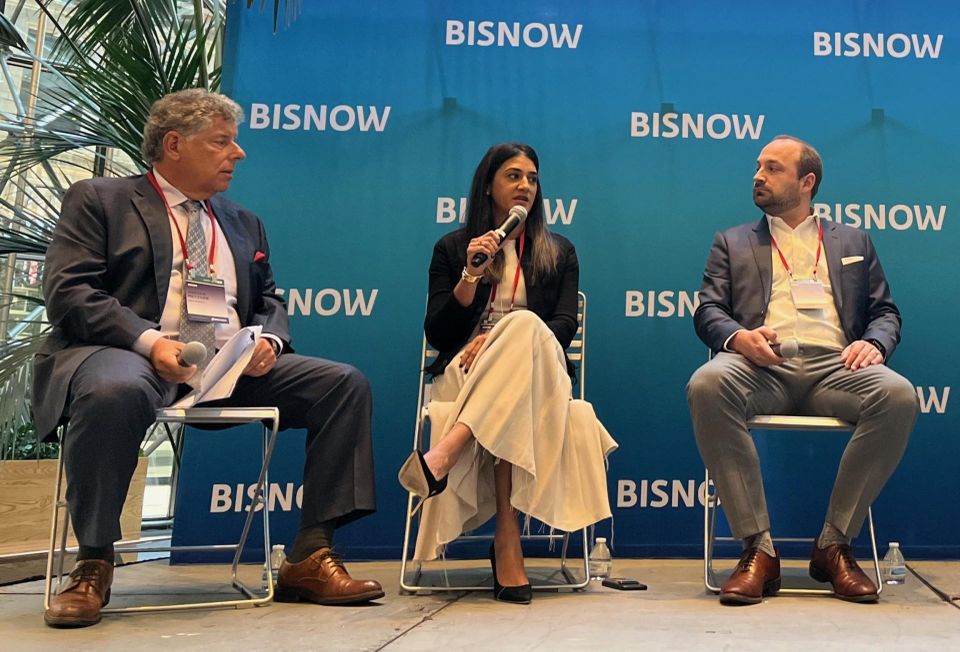 Cole Schotz's Jordan Metzger, Cerberus Capital Management's Neha Santiago and Slate Asset Management's Brendan Shanahan onstage at Bisnow's 2023 National Commercial Real Estate Finance Conference.