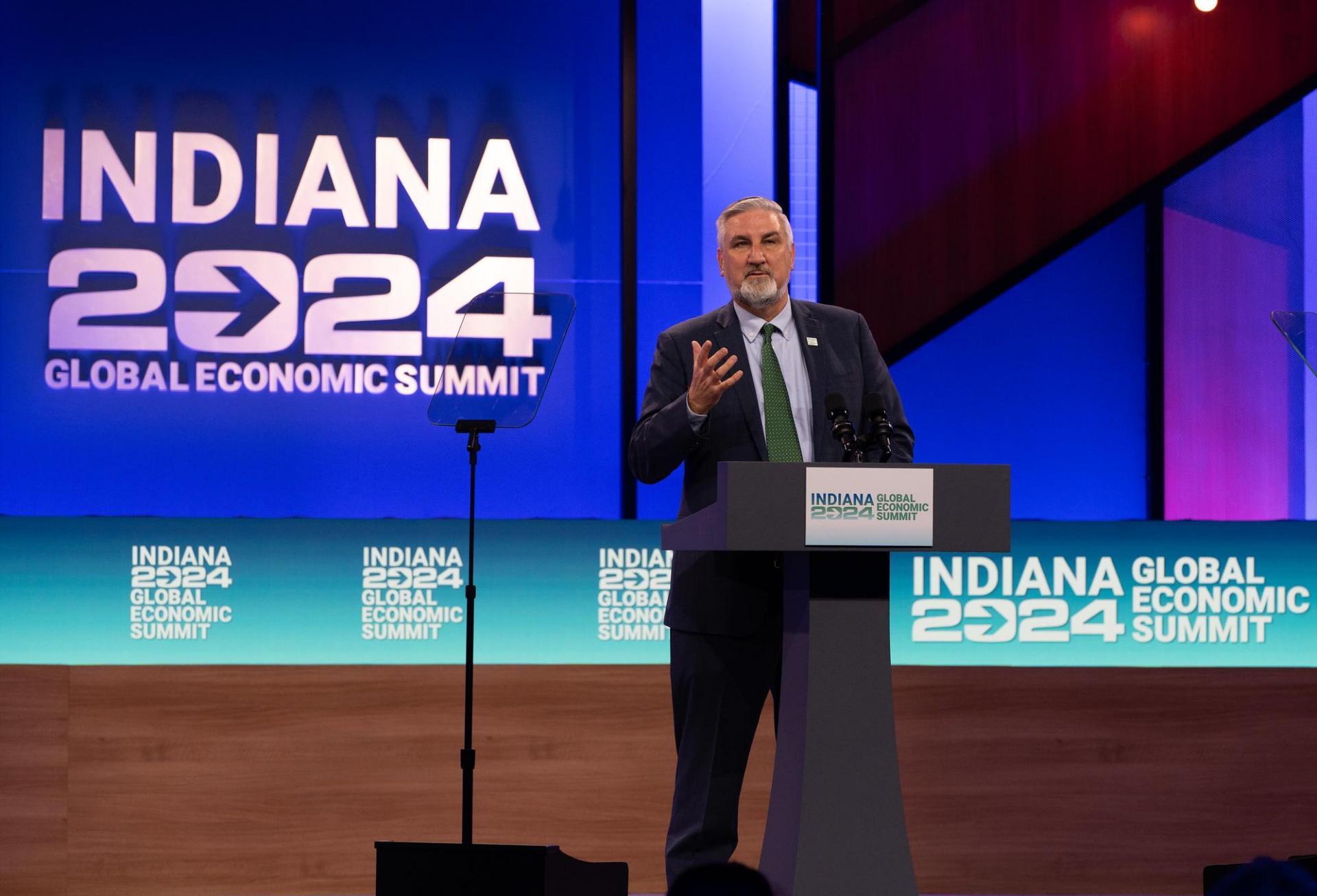 Indiana Gov. Eric Holcomb delivering remarks at the Indiana 2024 Global Economic Summit, where he announced a $5.3B manufacturing investment from Eli Lilly.
