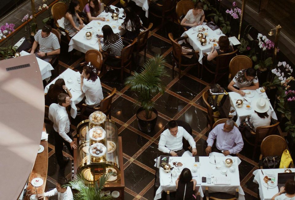 People sitting in a busy restaurant.