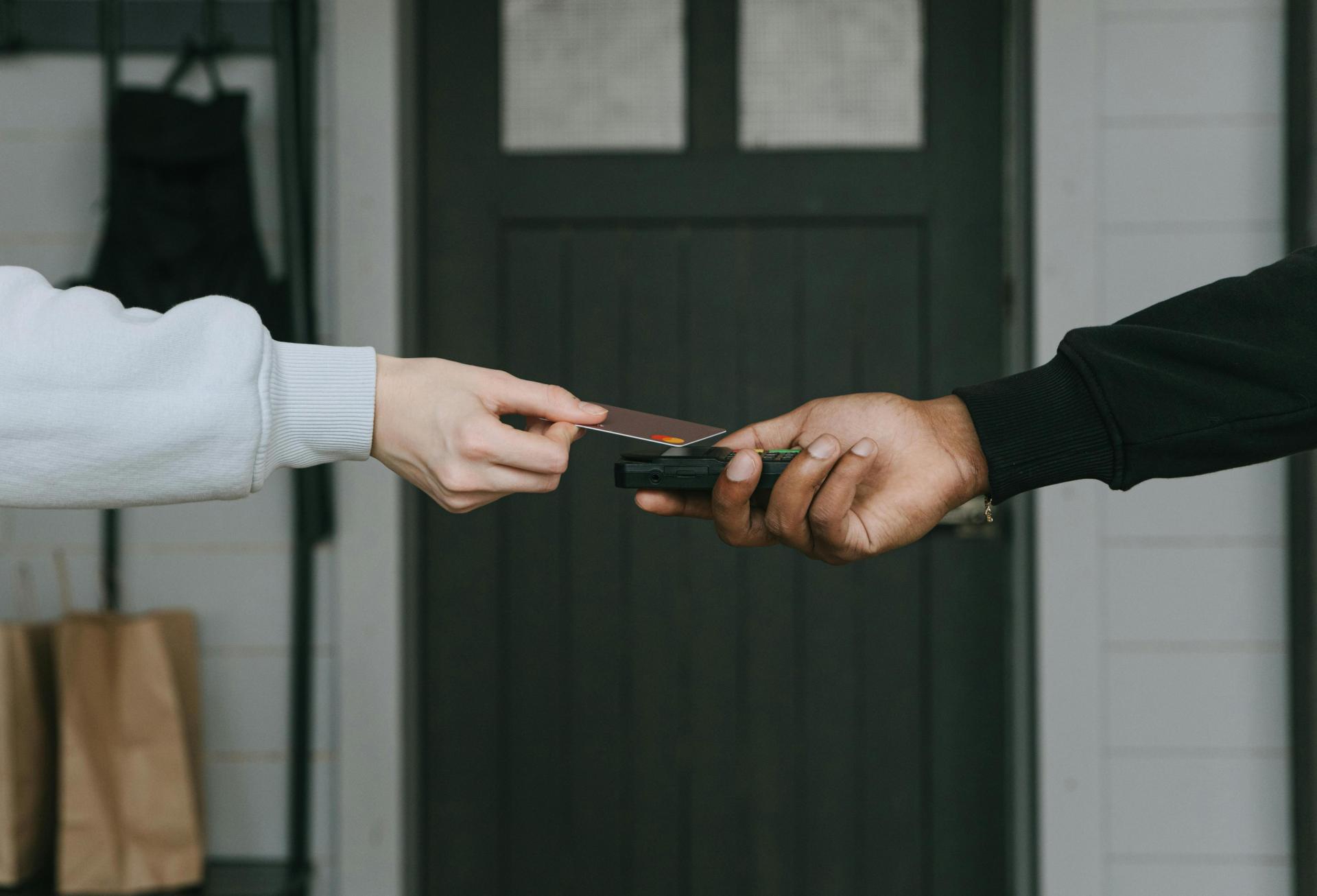 A credit card being swiped in a store