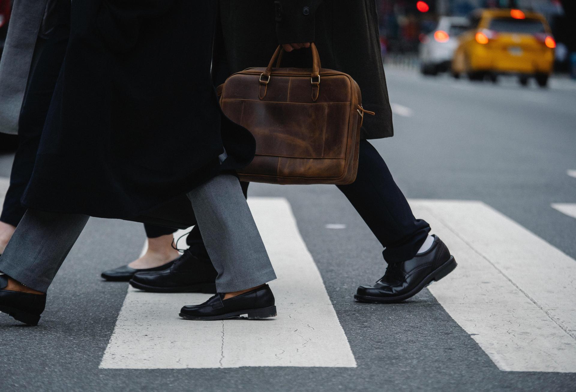 Office workers walking on a crosswalk