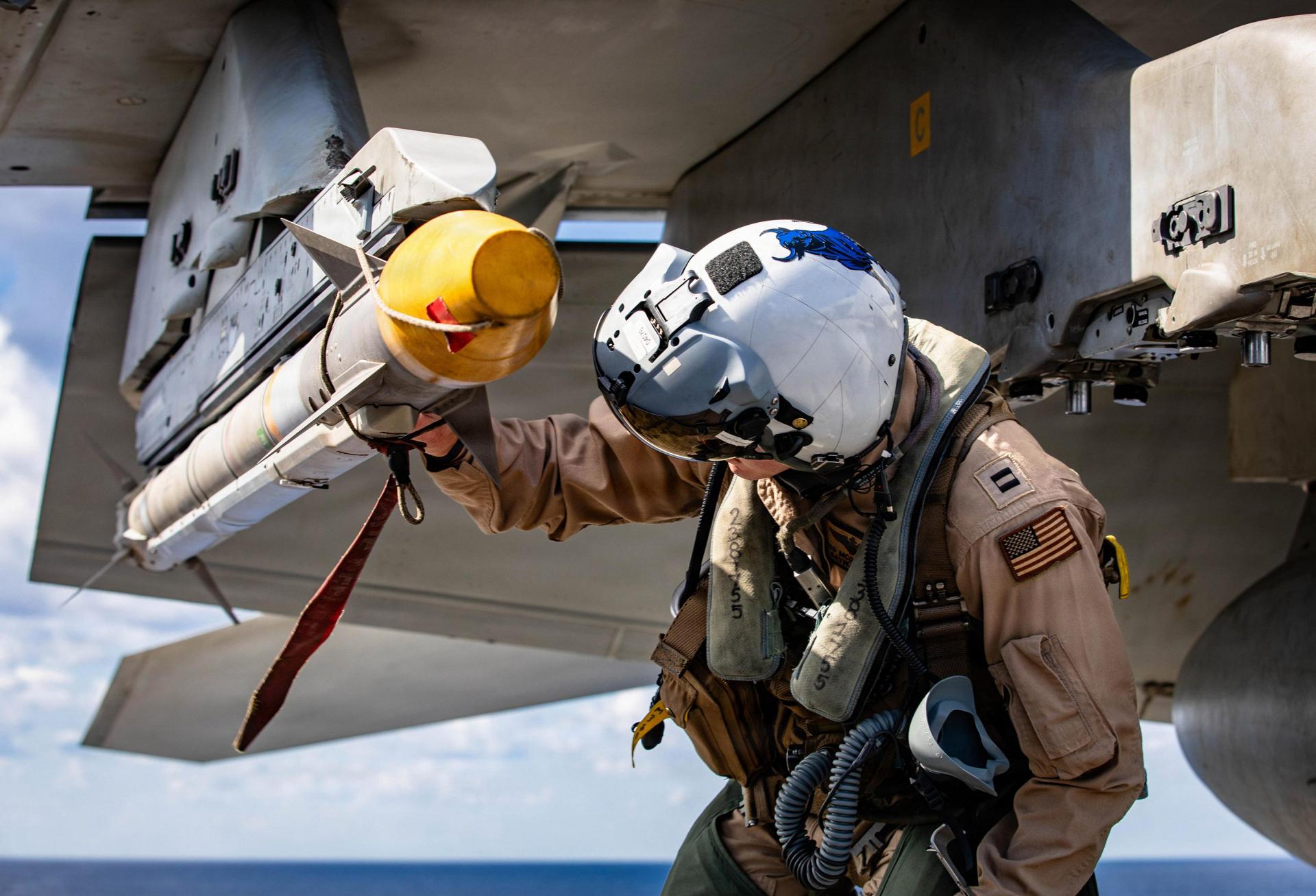 A sailor conducts preflight checks on a F-18 Super Hornet aboard the USS Gerald R Ford as the aircraft carrier supports Operation Epic Fury in the eastern Mediterranean Sea on March 2, 2026.
