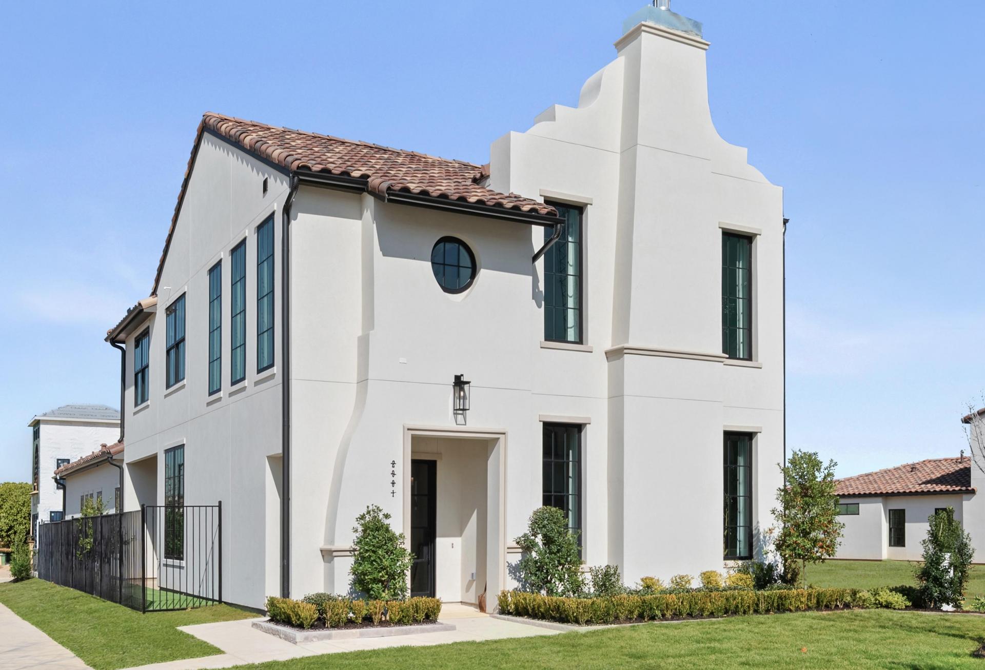 Two-story southwest-style house.