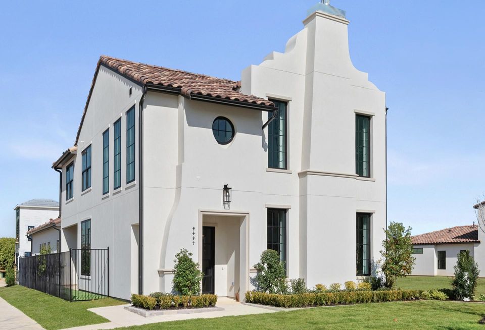 Two-story southwest-style house.