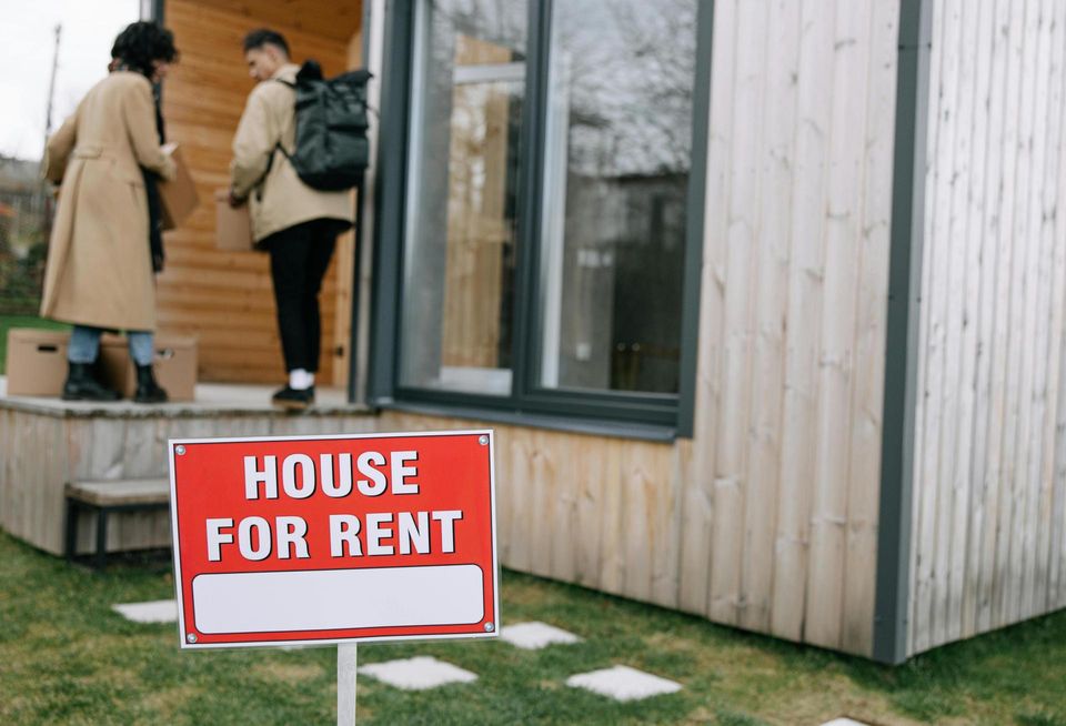 People entering a house for rent.