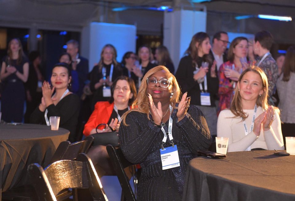 Attendees applaud the honorees at Bisnow's 2023 New York Women Leading Real Estate event.