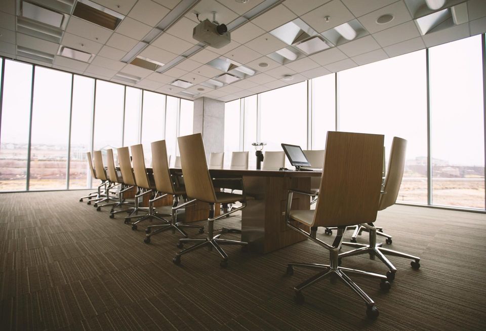 Empty boardroom filled with chairs