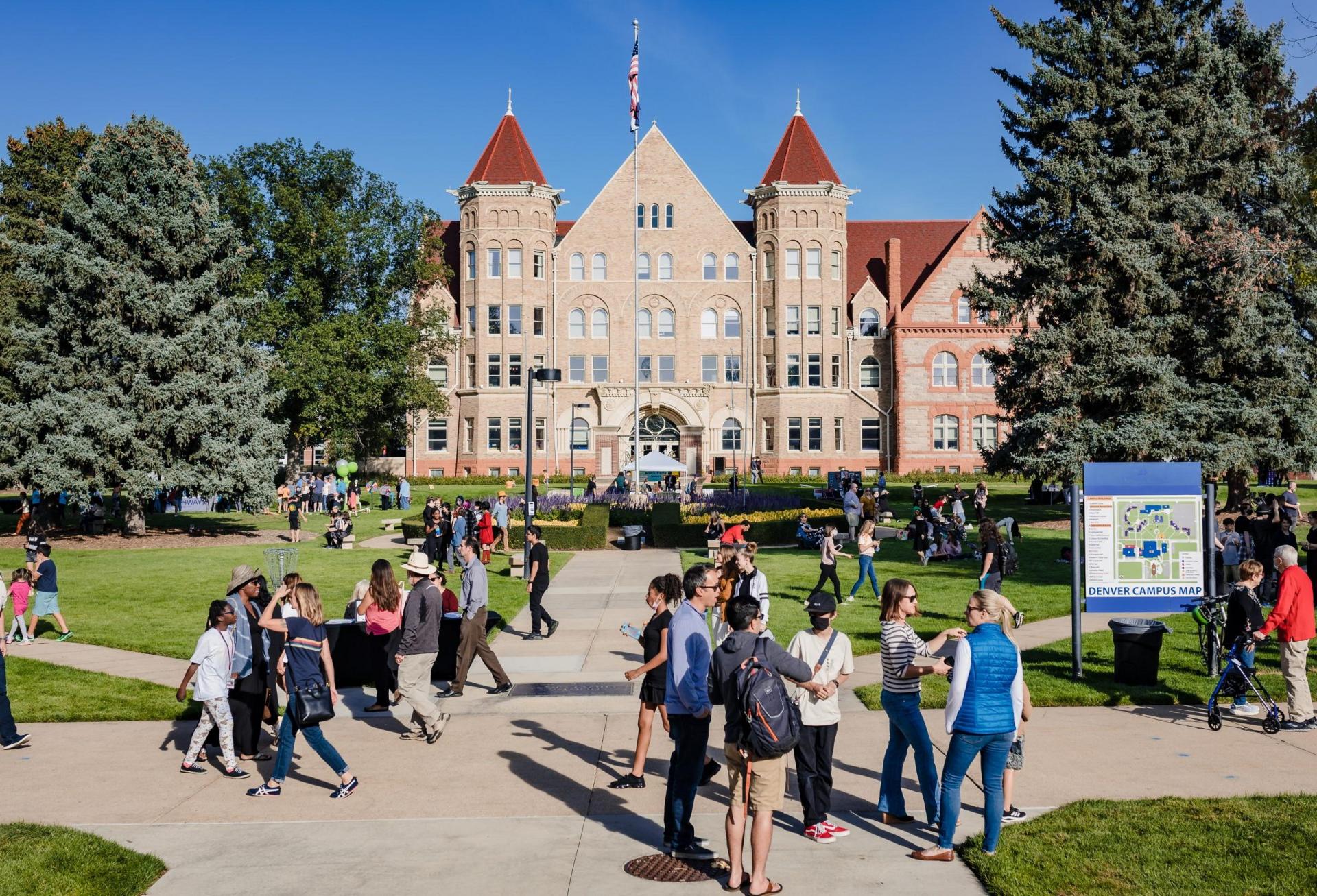Visitors walk around the former Johnson & Wales campus in Park Hill