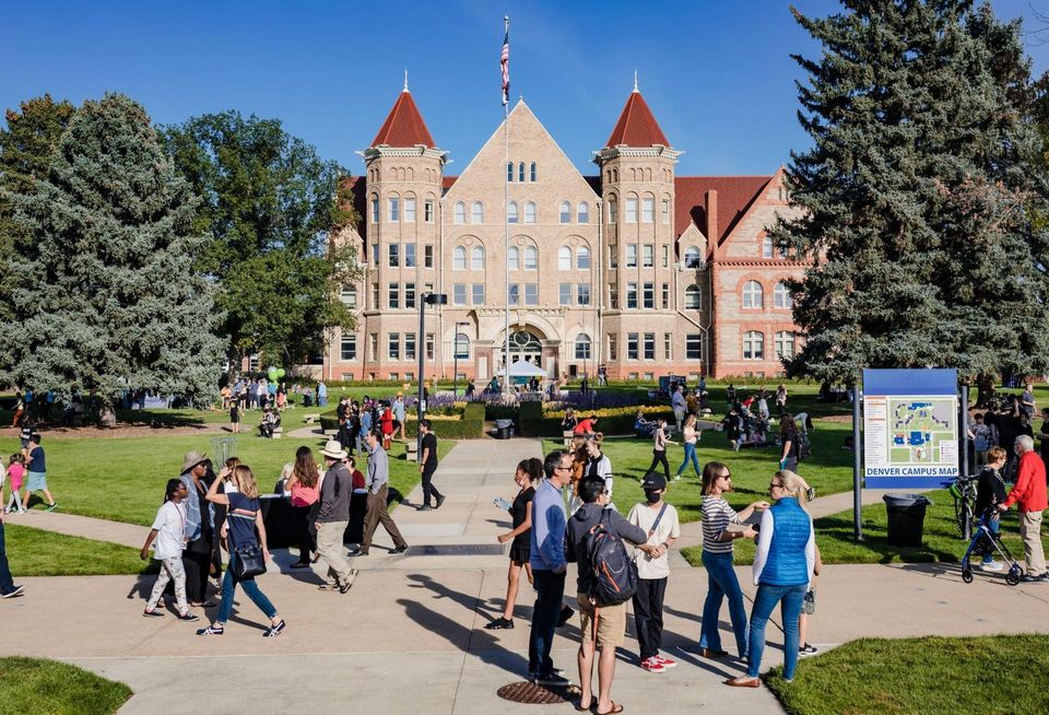 Visitors walk around the former Johnson & Wales campus in Park Hill