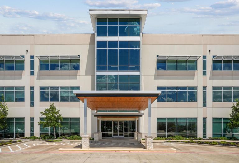 The entrance and exterior of a three-story medical office building