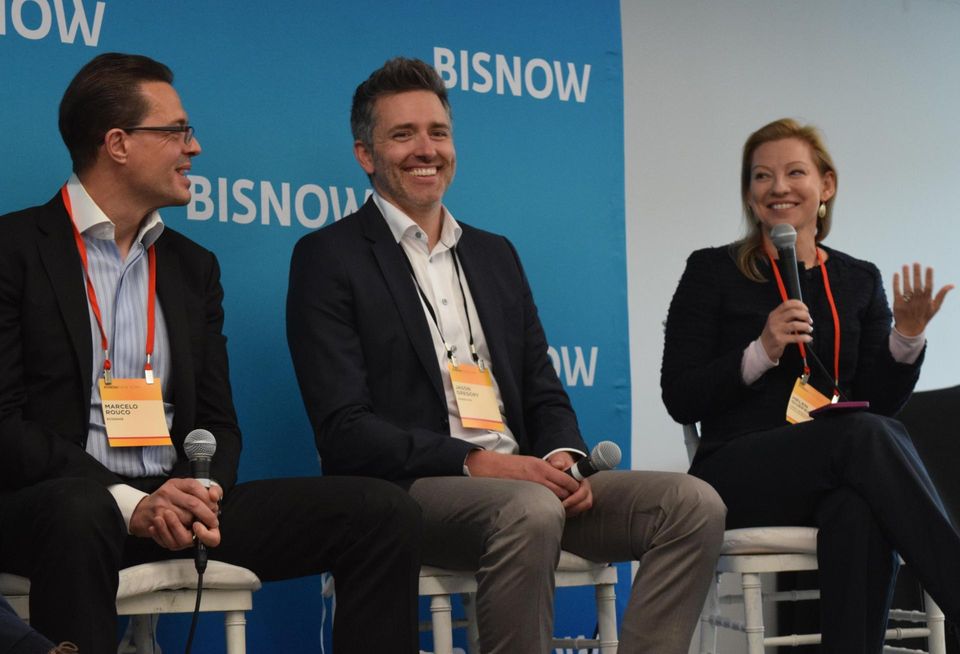 Ecosave's Marcelo Rouco, EnergyRM's Jason Gregory and CBRE's Helen Gurfel on stage at Bisnow's National Finance Summit in 2022.