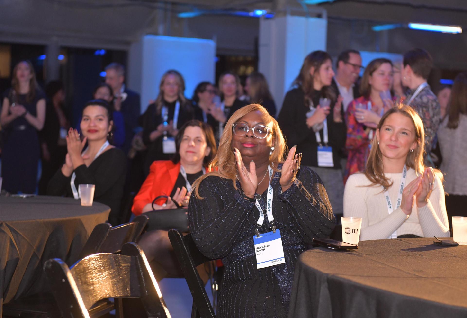 Attendees applaud the honorees at Bisnow's 2023 New York Women Leading Real Estate event.