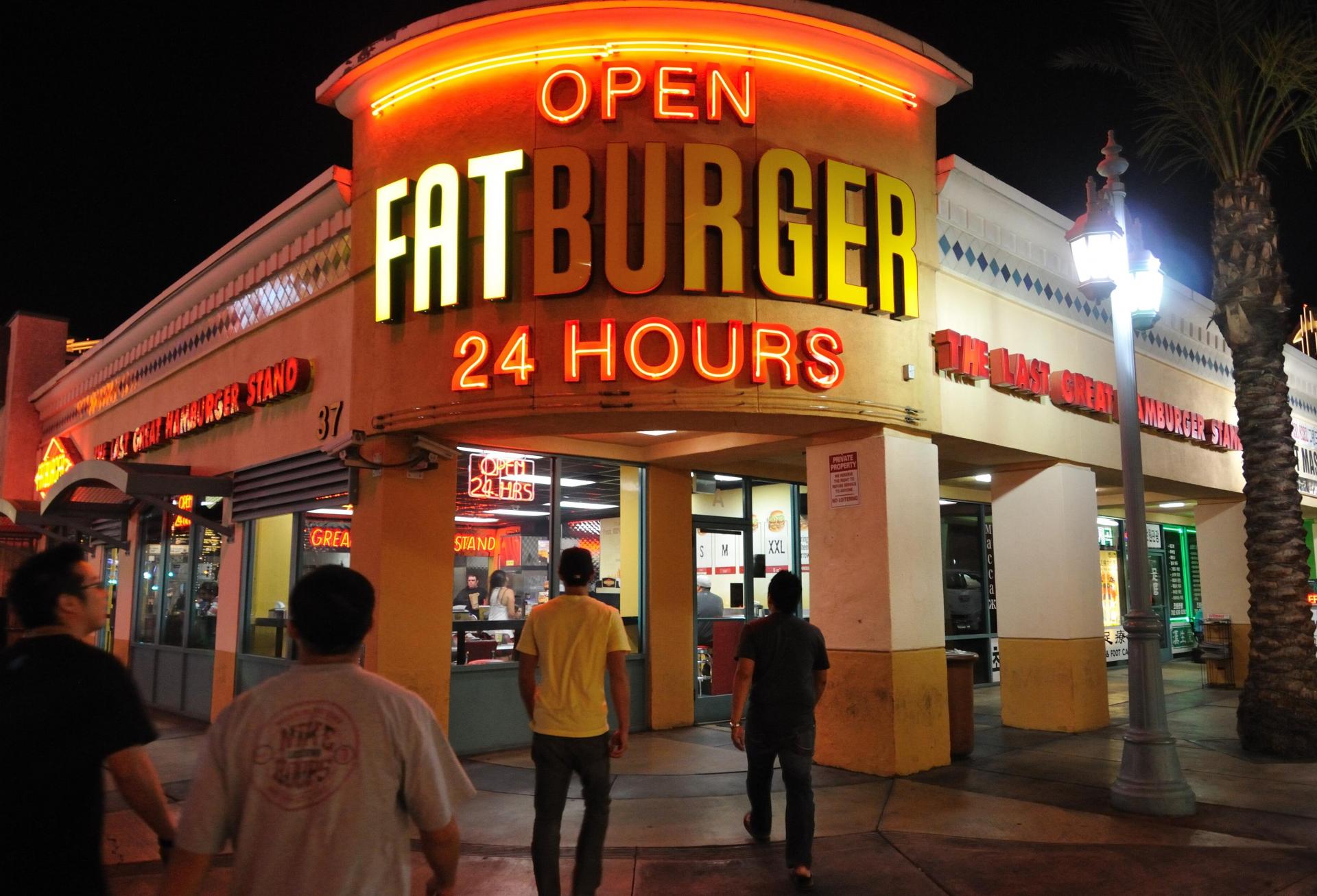 People walking into Fatburger.