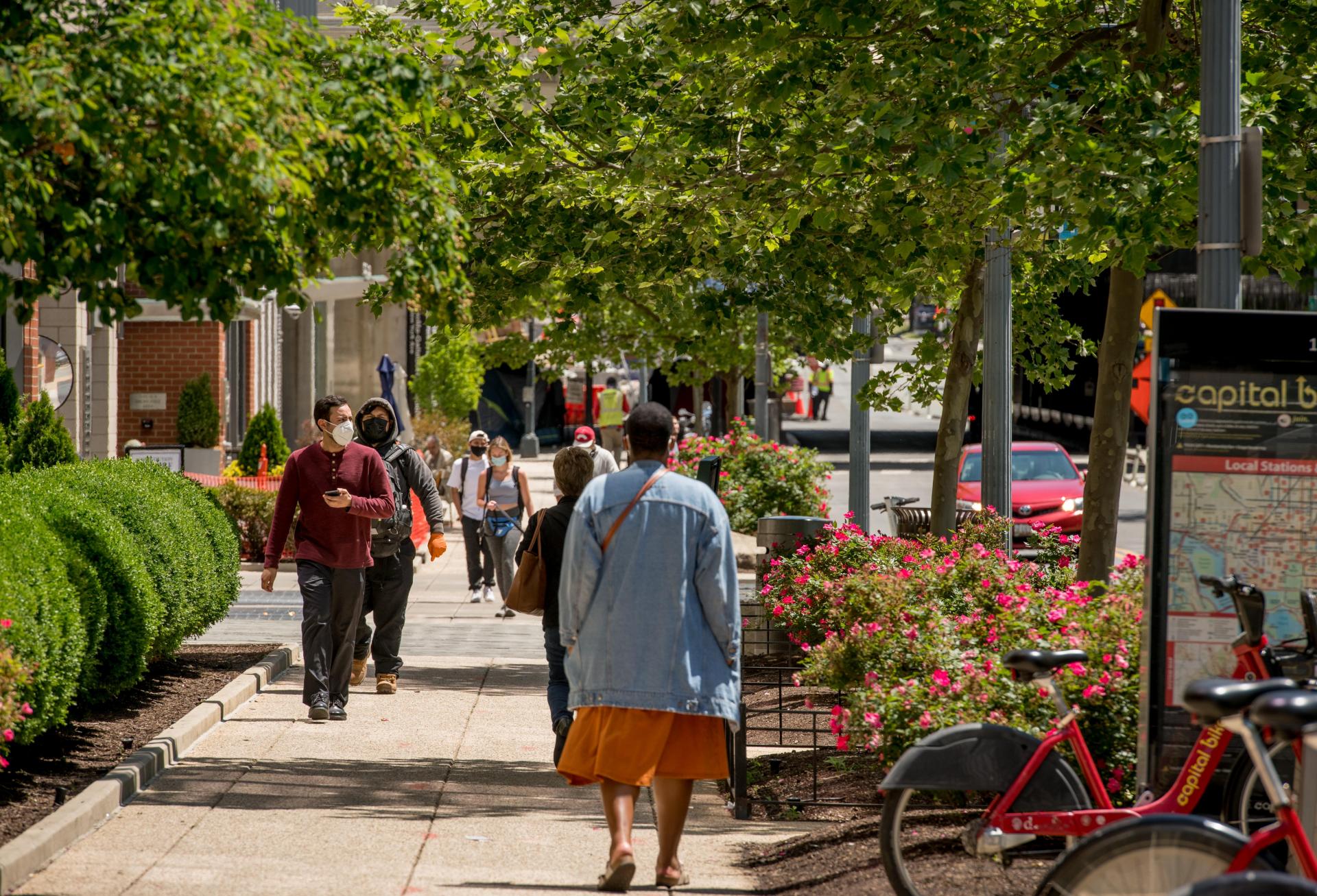 The Vast Majority Of Residents In Washington, D.c.’s Noma Neighborhood Get To Work Without A Car. people walking down the street