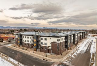 An aerial of the Ascent at Hover Crossing apartments with the mountains in the background
