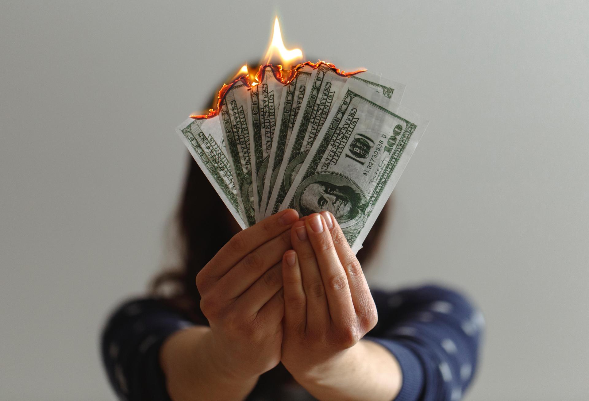 Lighting money on fire